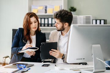 Diverse professionals collaborate on project analysis with financial graphs. Strategic teamwork and insights drive company growth and success.