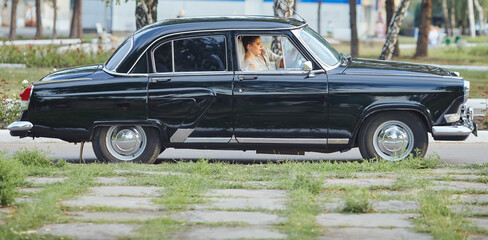 Elegant Bride in Classic Black Car