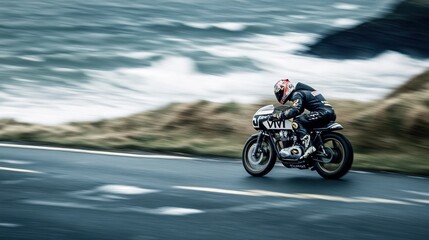 Motorcyclist racing along a coastal road with waves crashing against the shore in a dramatic action shot