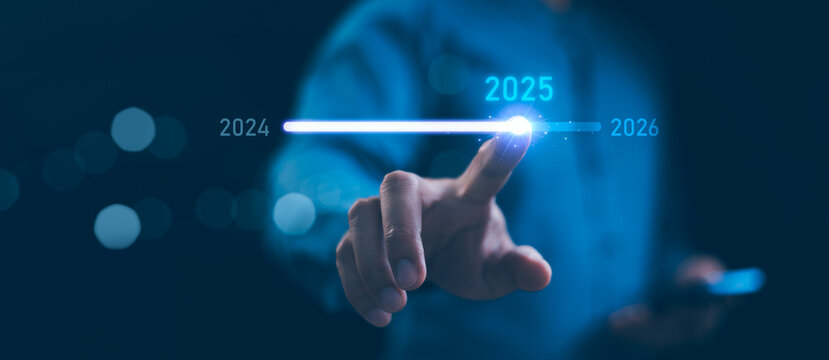 Businessman touch on loading progress from 2024 to 2025, Planning and challenge strategy in new year 2025 Concept. New business startup in 2025. 2025 is loading to 2026, calendar date, end of the year