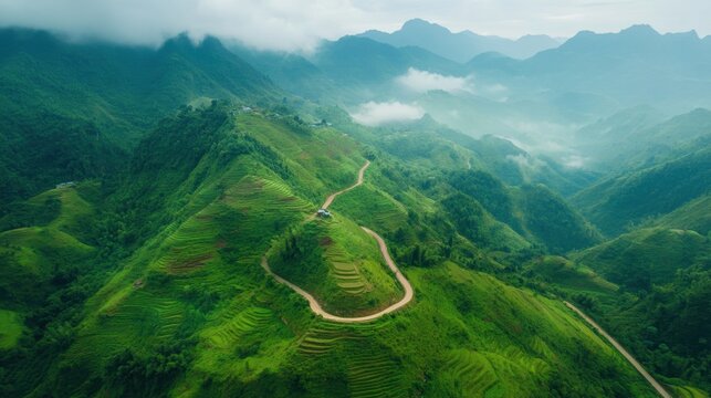 A cyclist climbing a steep mountain road with breathtaking alpine views
