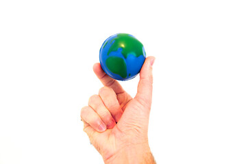 Hand Holding a Foam Globe Against a White Background