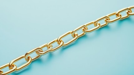 Obraz premium A simple gold chain styled against a powder blue background with soft lighting