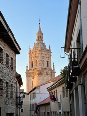 Cathedral bell tower framed by buildings in Burgo de Osma