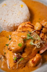 Grilled salmon with shrimp and rice.