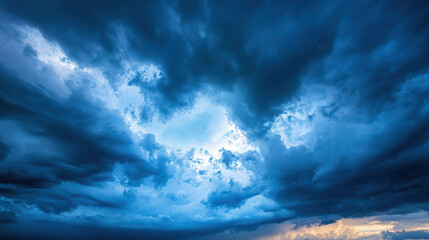 Obraz premium Dramatic storm clouds gather in vibrant blue sky, creating captivating atmosphere