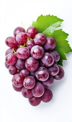 Fototapeta premium Red Grapes with Leaves on White Background. Close-up of Vibrant Cluster and Green Foliage.