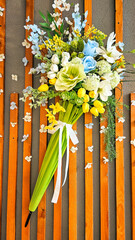Florist. Autumn atmosphere. Floral background. decorative. Hello Autumn. Flower shop. bouquet of flowers on a wood background, beautiful bouquet under an umbrella, vertical, mobile, green umbrella
