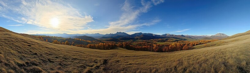 Fototapeta premium panoramic view of the Mountains, sun shining on top left corner, mountain range in background