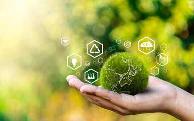World environment day, Responsibility for a green planet, Sustainable growth, and global conservation.Businessman holding green world, Sustainable development goals and corporate social responsibility