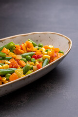 Mexican Mix of Vegetables. Tomatoes, Green Beans, Peas, Corn. Dietary Food.Bright vegetable mix .Vegetarian food.Assorted.