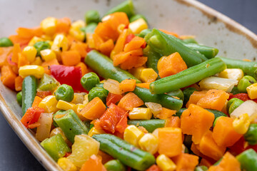 Mexican Mix of Vegetables. Tomatoes, Green Beans, Peas, Corn. Dietary Food.Bright vegetable mix .Vegetarian food.Assorted.