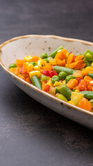 Mexican Mix of Vegetables. Tomatoes, Green Beans, Peas, Corn. Dietary Food.Bright vegetable mix .Vegetarian food.Assorted.