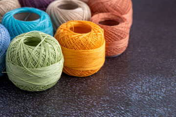 Multicolor yarn for knitting, knitting needles and scissors. Home storage concept and hobby.Raffia is an organic, ecological, wood fiber that is easy to crochet.