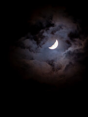 Crescent Moon Amid Mysterious Clouds