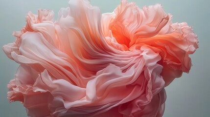 Fototapeta premium Soft pink silk fabric flowing elegantly under warm light