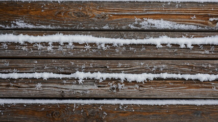 Detailed Snowflakes on Wooden Plank Creating a Wintery Aesthetic Background