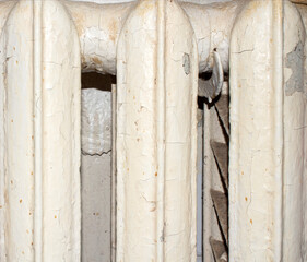 An old Soviet heating battery.Radiator for indoor heating.Heating battery background.The heat source.