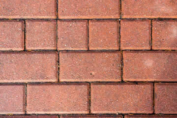 Red paving stone sidewalk - background.