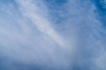 White cloud with blue sky for use in graphics as a background.