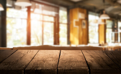Rustic wooden table in a sunlit cafe. Perfect for product placement or showcasing your brand.