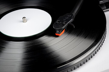 Vinyl turntable with vinyl plate. Modern gramophone record player. Retro sound technology to play...