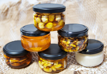 Different types of nuts with honey