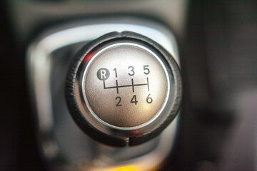 Close up of a six speed manual gear shift knob in a vehicle