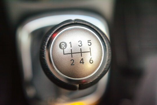 Close up of a six speed manual gear shift knob in a vehicle