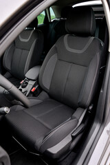 Modern car interior with black fabric seats