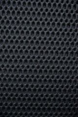 Close up texture of dark breathable mesh fabric Ideal for sportswear or upholstery