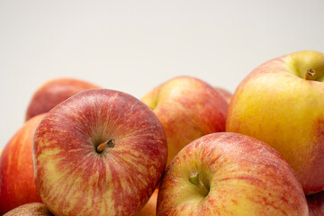 Red apples close-up on a white background. Copy space