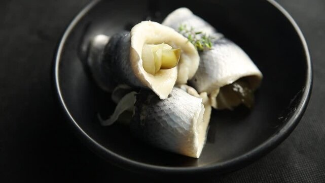 Rollmops herring roll with onion and pickles appetizer fresh tasty food dish delicious gourmet food background on the table rustic food top view copy space vegetarian food pescetarian diet