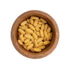 vitamin pills in bowl isolated on white background
