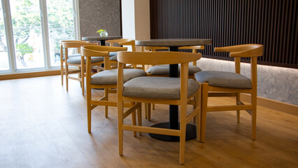 elegant wooden furniture of antique table and chairs in cafe