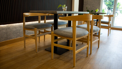 elegant wooden furniture of antique table and chairs in cafe