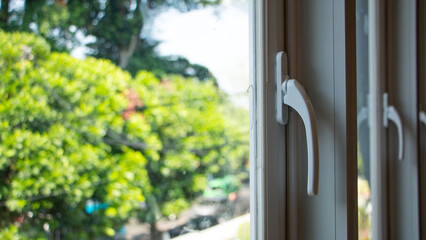 white window handles in city apartments