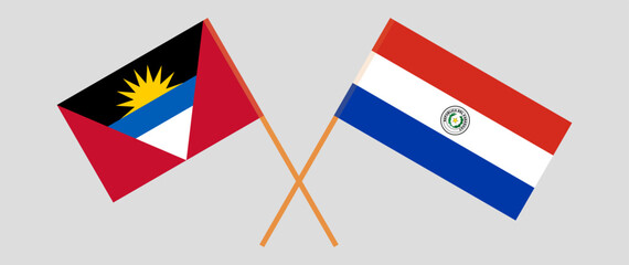 Crossed flags of Antigua and Barbuda and Republic of Paraguay. Official colors. Correct proportion. Vector illustration