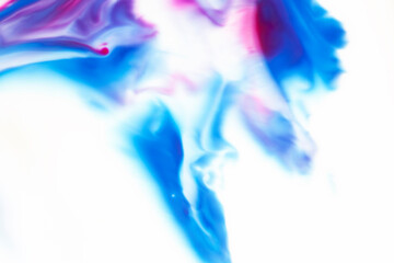 A blue and pink swirl of paint on a white background