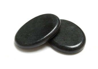 two massage stones on white background