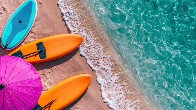 Colorful surfboards and a pink umbrella on a sandy beach beside clear turquoise waters create a vibrant summer scene. - Powered by Adobe