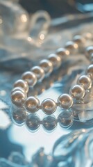 Pearl necklace on reflective surface (1)