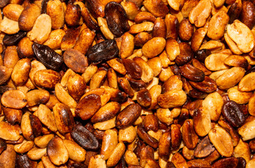 Fried salted peanuts.The texture of roasted peanuts.Fried peanuts background.Peanuts for beer.