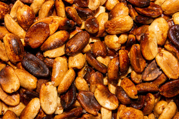 Fried salted peanuts.The texture of roasted peanuts.Fried peanuts background.Peanuts for beer.