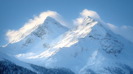 Obraz premium Majestic snow-capped mountain peaks under a vibrant blue sky.