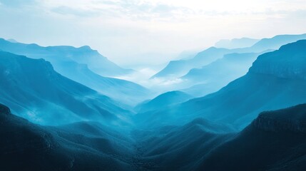 Fototapeta premium Misty mountain valley, tranquil blue tones.