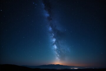milky in the sky with a mountain in the background