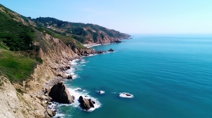 Aerial view of a serene coastal landscape with rocky cliffs.