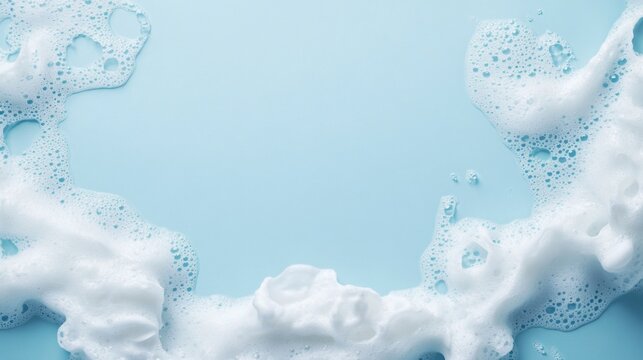 Soap foam and bubbles on blue background for cleaning and beauty services