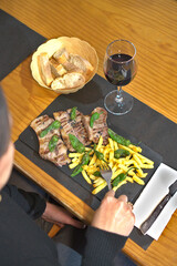 A horizontal shot showcasing a rustic and hearty plate of grilled lamb chops. 